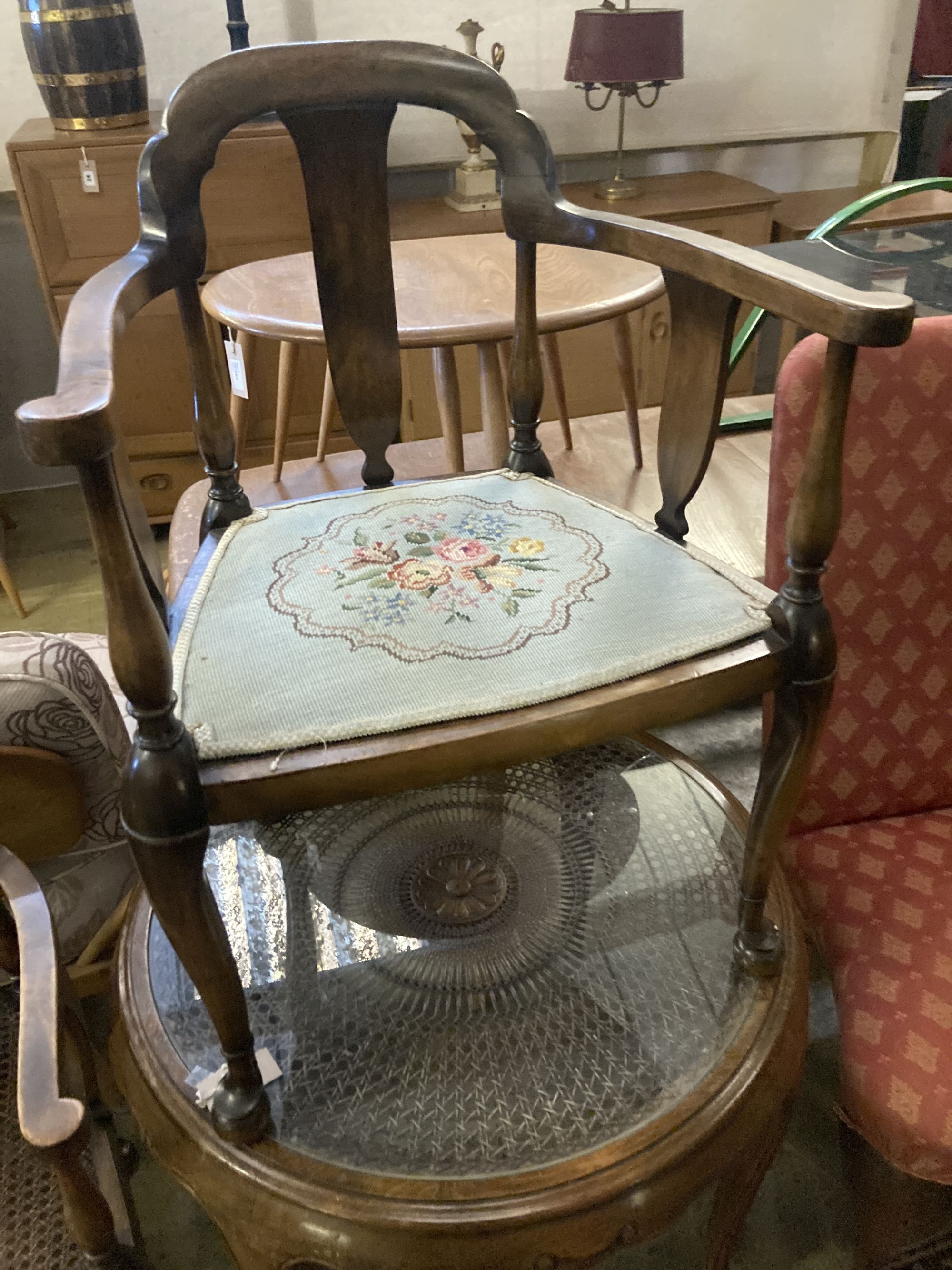 A 1920s circular caned beech occasional table, diameter 76cm, together with a pair of elbow chairs, one with a later tapestry seat